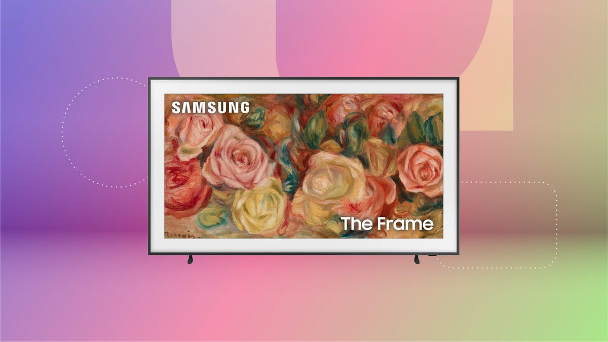 A Samsung "The Frame" TV with a painting of flowers on the screen against a purple, pink and green gradient background.