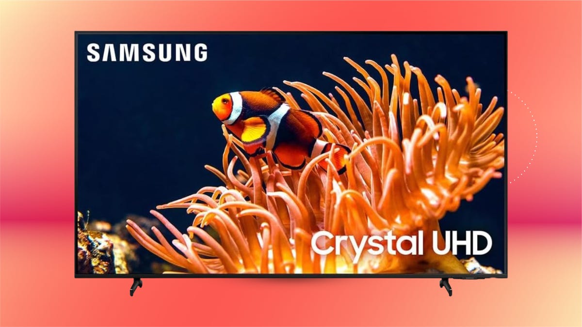 The 85-inch Samsung DU8000 TV is displayed against an orange and red background.