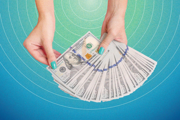 hands with teal nails holding a fan of cash against a teal background